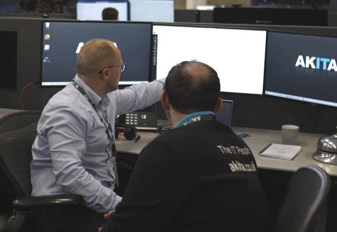 IT security consultant working with IT engineer