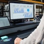 Man looking at Dynamics CRM system on desktop